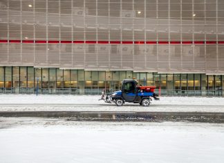 black motorcycle parked on snow covered ground