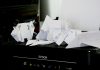 a pile of papers sitting on top of a black box