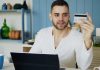 Digital Withdrawal, ADR, and Dark Patterns: Why the Interface Matters More and More for Online Sellers in Europe Man holding credit card while looking at laptop