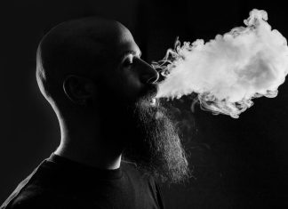 man smoking with black background