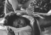 grayscale photo of woman hugging baby
