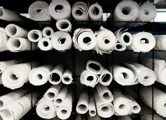 A rack full of rolls of white toilet paper