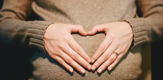 person holding belly photo