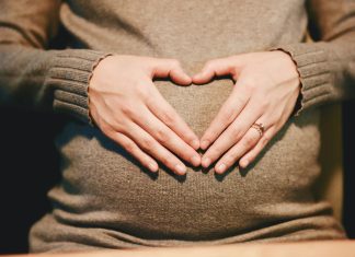 person holding belly photo