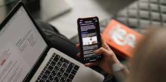 person holding black iphone 4
