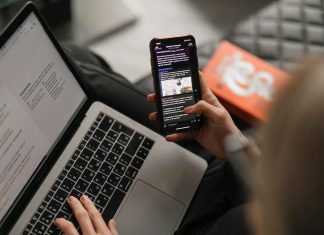 person holding black iphone 4