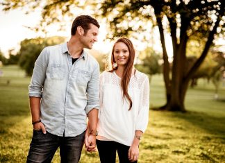 Practical Relationship Tips for Married Couples man holding hand of woman standing near tree