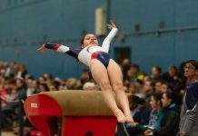How Gymnastics Uniforms Support Performance woman in black sports bra and black leggings lying on brown concrete bench