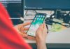Flutter vs Cross-Platform Development: Is Hiring a Flutter Specialist Worth It Over a Generalist? person using silver iPhone X