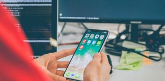 person using silver iPhone X