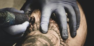 a person with a tattoo on their arm