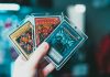 person holding yu gi oh trading card