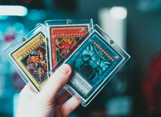 Trading Card Care Tips for Serious Collectors person holding yu gi oh trading card