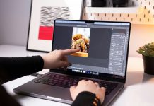 Vidmud Photo Enhancer and AI Photo Editor Review: Is It Worth Using in 2026? A person sitting in front of a laptop computer