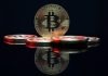 a bit coin sitting on top of a table