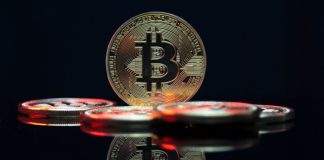 a bit coin sitting on top of a table