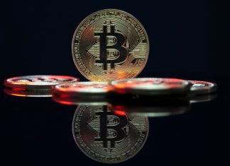 a bit coin sitting on top of a table