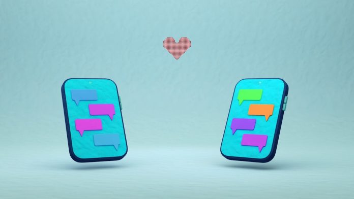 Photo by Omar:. Lopez-Rincon Two phones with chat bubbles and a red heart.