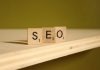 a wooden block that says seo on it