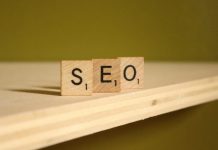 How to Choose an AI SEO Agency that Understands Search, Content, and LLM Visibility? a wooden block that says seo on it