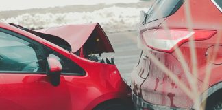 a red car parked next to another red car