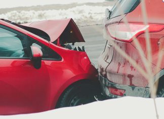 a red car parked next to another red car