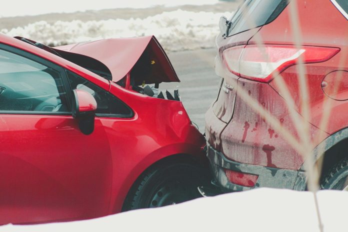 Photo by Compagnons a red car parked next to another red car