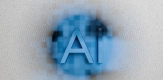 The letters ai are displayed on a blurred background.