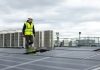 a man standing on top of a roof