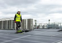 a man standing on top of a roof