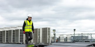 a man standing on top of a roof