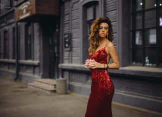 London after dark: how a city learned to have a good time woman in red spaghetti strap dress standing on road during daytime