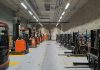 A large warehouse filled with lots of machines