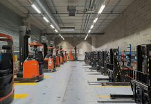 A large warehouse filled with lots of machines