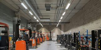 A large warehouse filled with lots of machines