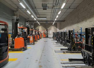 A large warehouse filled with lots of machines
