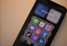 Social Media Regulations and the Push for Stronger Laws a black cell phone