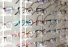 arranged assorted-color eyeglasses on rack