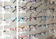 arranged assorted-color eyeglasses on rack