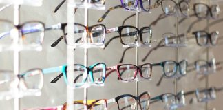 arranged assorted-color eyeglasses on rack