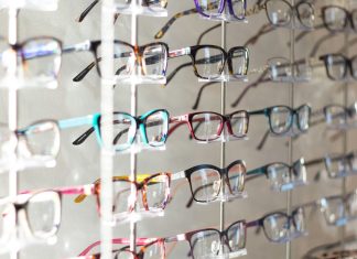 arranged assorted-color eyeglasses on rack