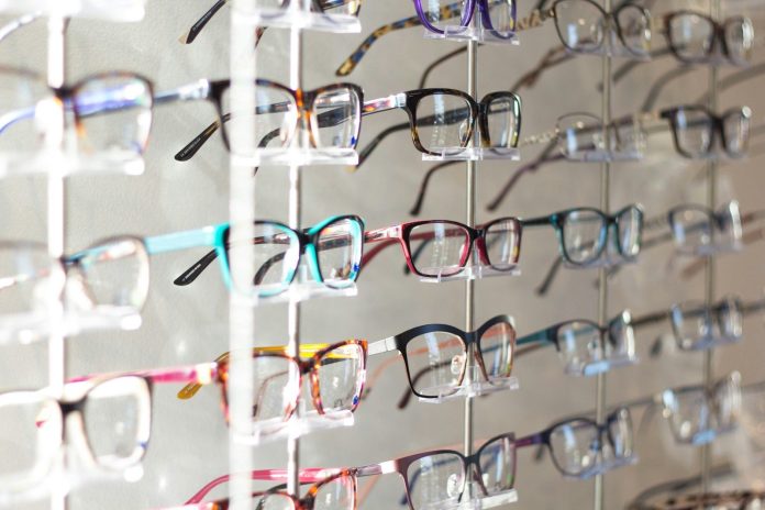 Photo by Scott Van Daalen arranged assorted-color eyeglasses on rack