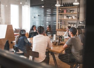How Workplace Standards Help Businesses Stay Competitive people sitting on chair