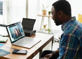 Why More People Are Choosing Online Substance Abuse Therapy for Lasting Recovery man in blue and white plaid dress shirt using macbook pro