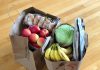 How to Start Making Food Donations apples and bananas in brown cardboard box