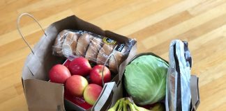 apples and bananas in brown cardboard box