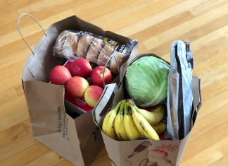 How to Start Making Food Donations apples and bananas in brown cardboard box