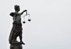 How Time Spent in Custody Can Be Considered at Sentencing A statue of lady justice holding a scale of justice