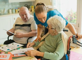Unpacking the Benefits of Home Health Care in Corpus Christi Caregiver assisting elderly couple with coloring