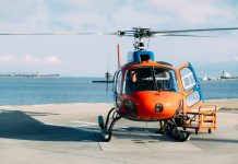 How Private Helicopter Transfers Make Traveling to Paros Easier orange helicopter